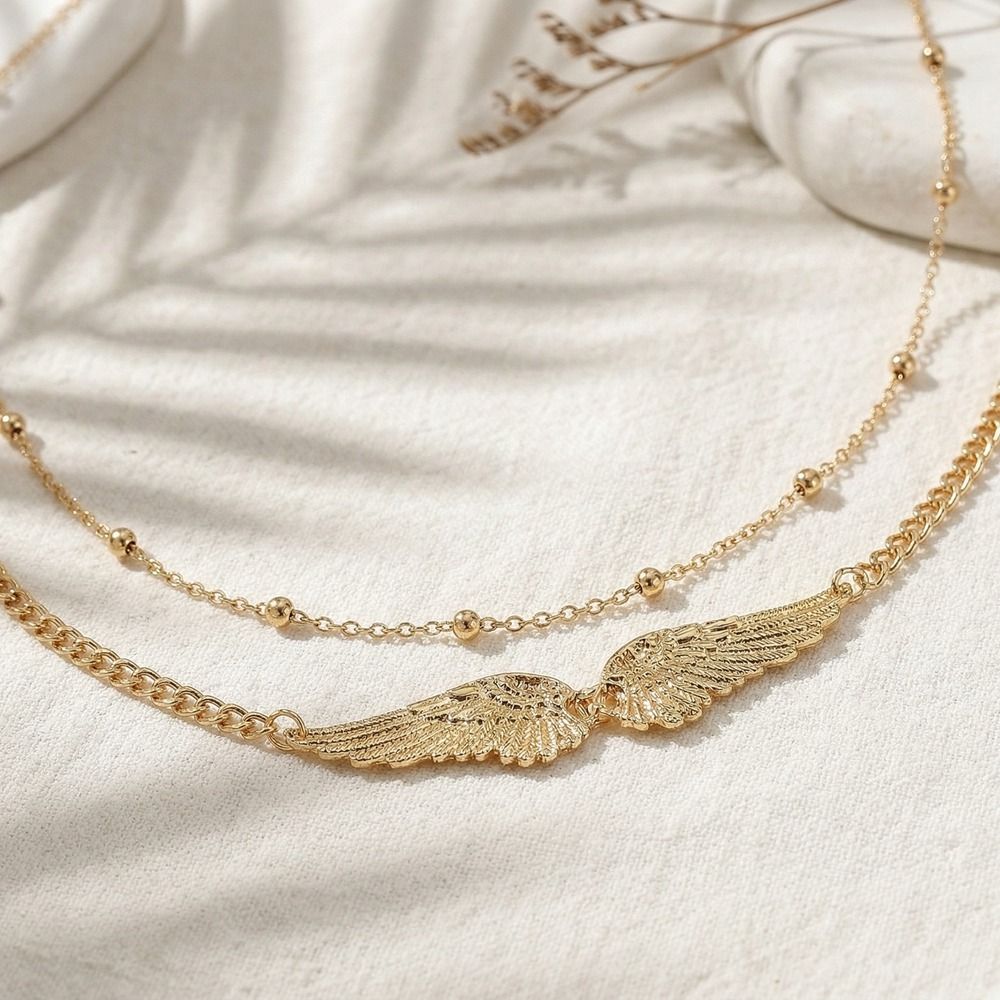 Elegante doppellagige Flügel-K – Body Jewelry Bewertung und Preis